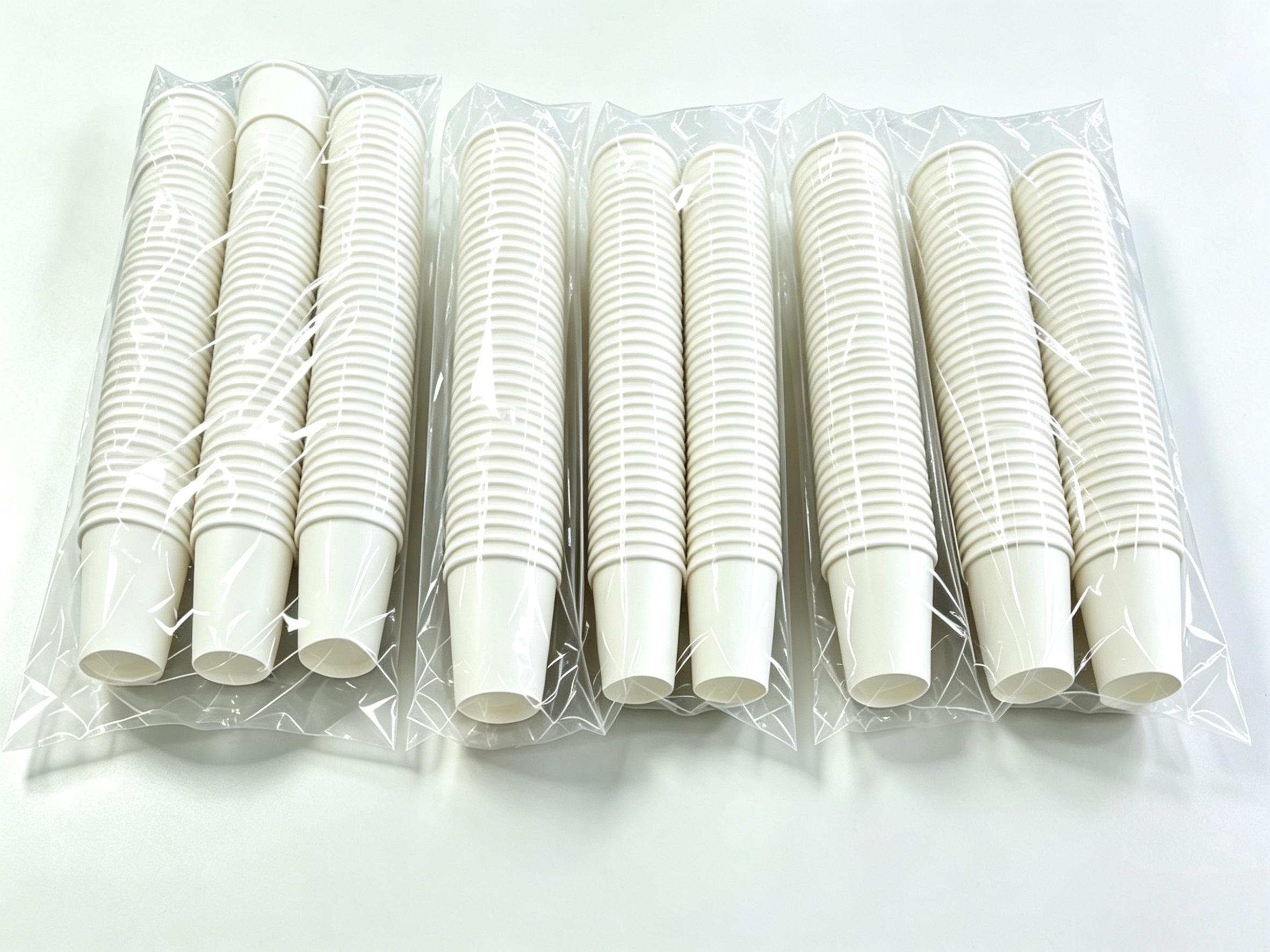 Neatly stacked and tightly sealed disposable cup lids demonstrating packaging performance