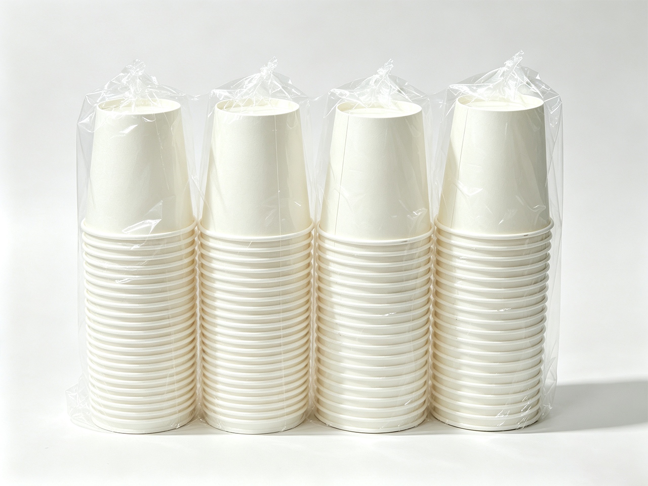 ML-650 Automatic Film Packaging Machine processing paper cup lids with precise film wrapping